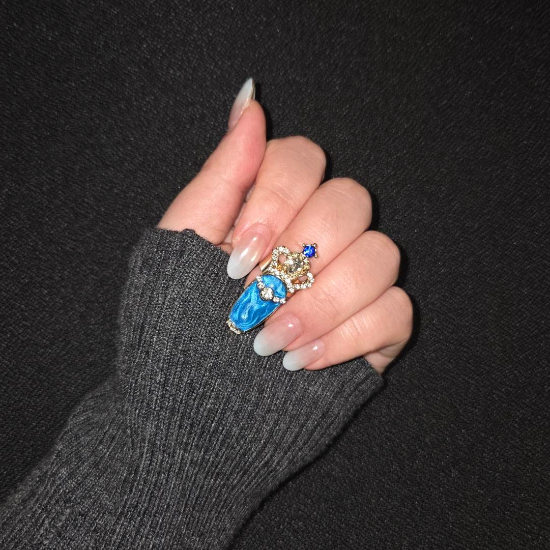 Sapphire Starfall Nail Ring nail rings on hand — lifestyle | GlossyMuse