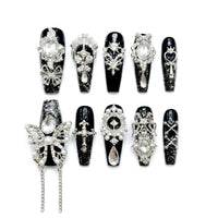 Black Charm Muse almond medium handcrafted press-on nails — front view | GlossyMuse