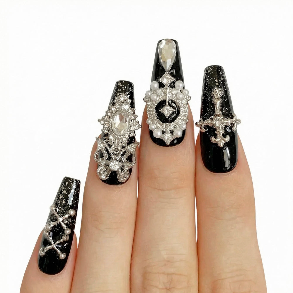 Model wearing Black Charm Muse almond press-on nails — lifestyle close-up | GlossyMuse