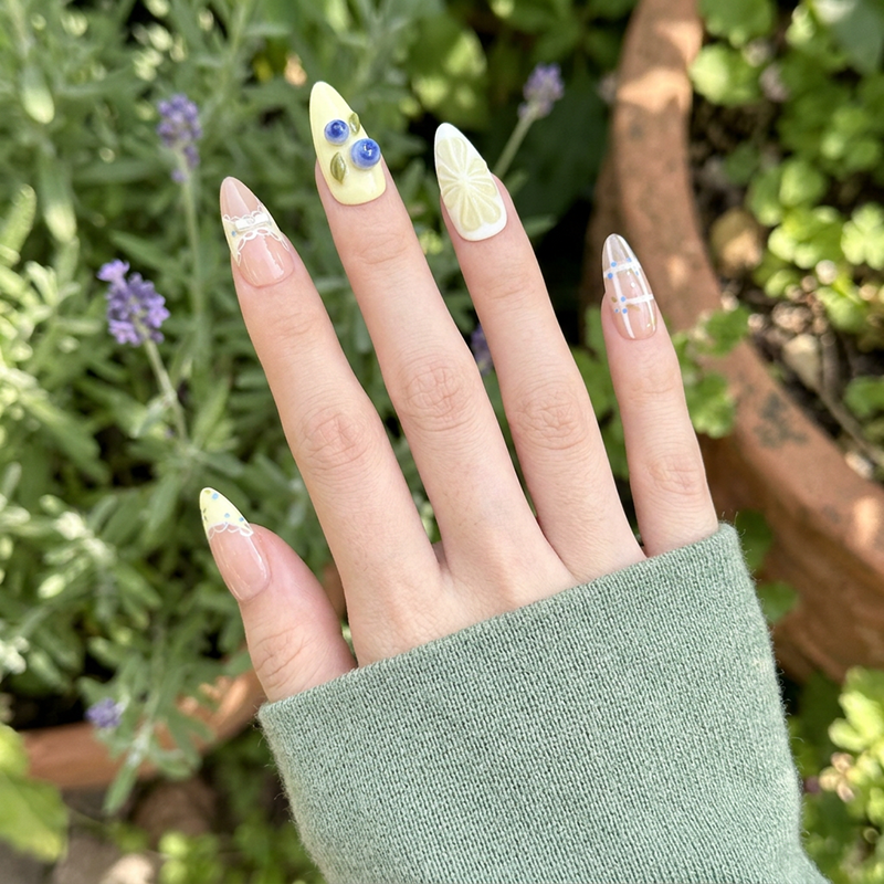 Blueberry Lemon Mojito press-on nail kit contents — adhesive tabs, file and cuticle pusher | GlossyMuse