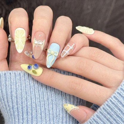 Model wearing Blueberry Lemon Mojito almond press-on nails — lifestyle close-up | GlossyMuse