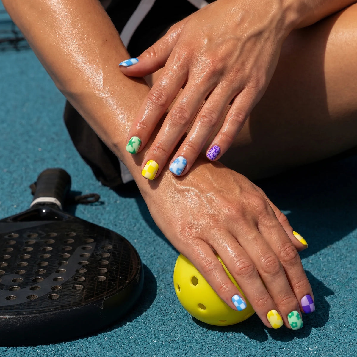 Game Day Pop nails on hand — bold star and animal print pickleball press-ons | GlossyMuse