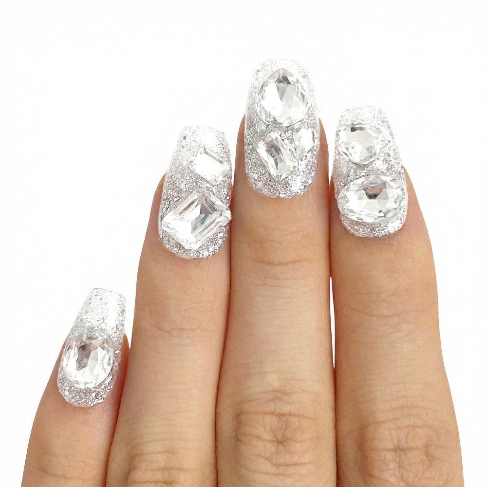 Model wearing Crystal Gloss Spark almond press-on nails — lifestyle close-up | GlossyMuse