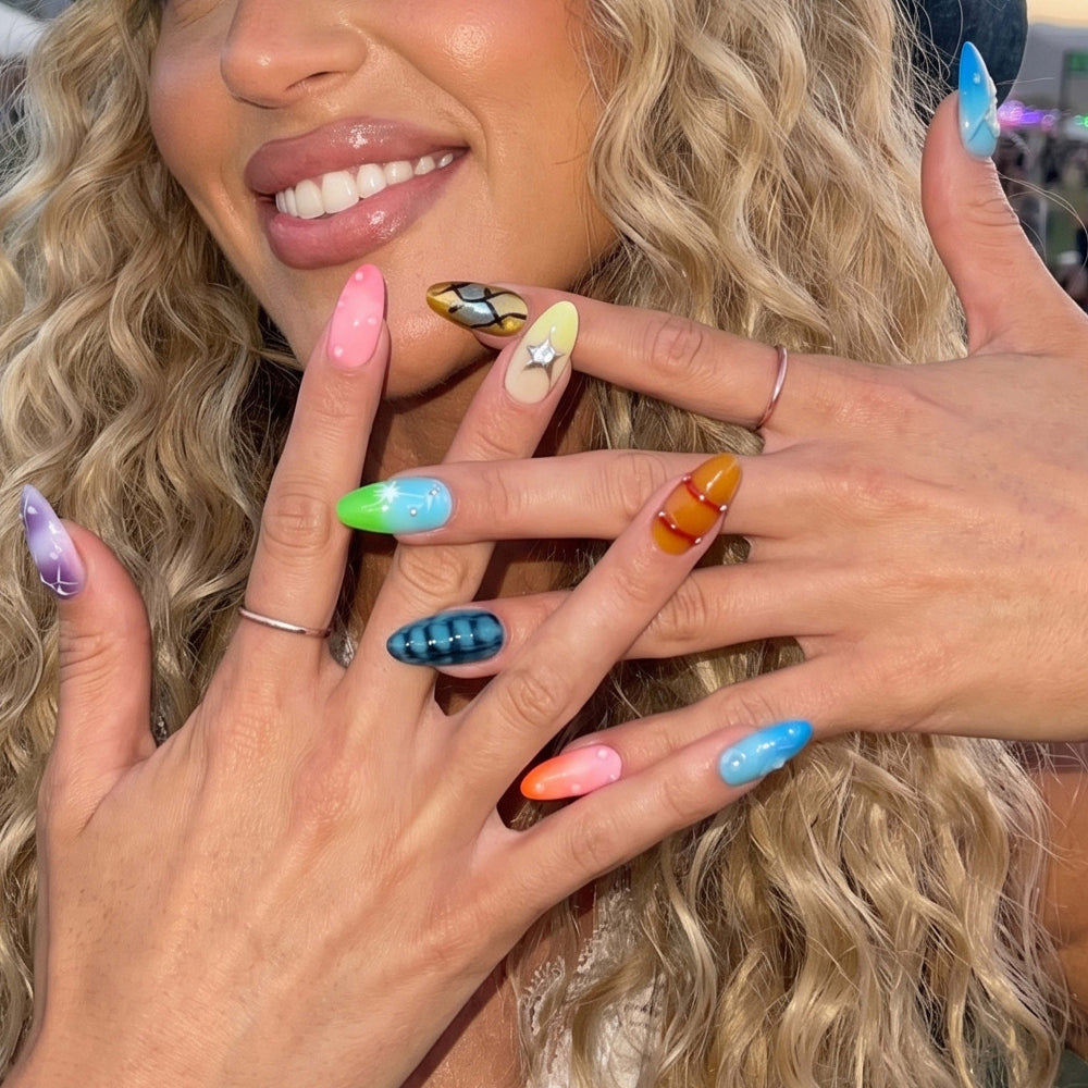 Ten colorful nail art samples featuring designs like stars, bubbles, and stripes.