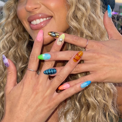Ten colorful nail art samples featuring designs like stars, bubbles, and stripes.