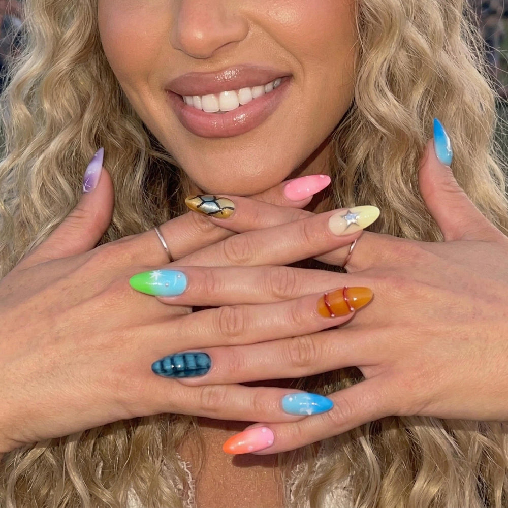 Ten colorful nail art samples featuring designs like stars, bubbles, and stripes.