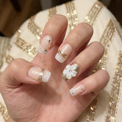 Floral Bliss  Daisy Glow press-on nail kit contents — adhesive tabs, file and cuticle pusher | GlossyMuse
