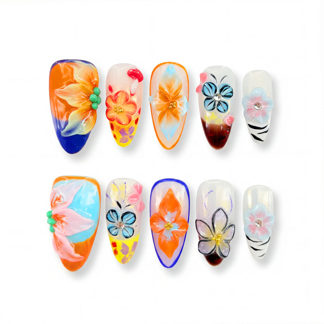 Ten colorful nail designs featuring flowers, patterns, and various embellishments. Blue nails, Orange nails