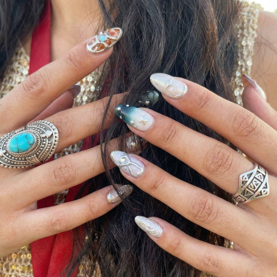 Ten colorful nail designs with various patterns and embellishments, including stars and pearls.