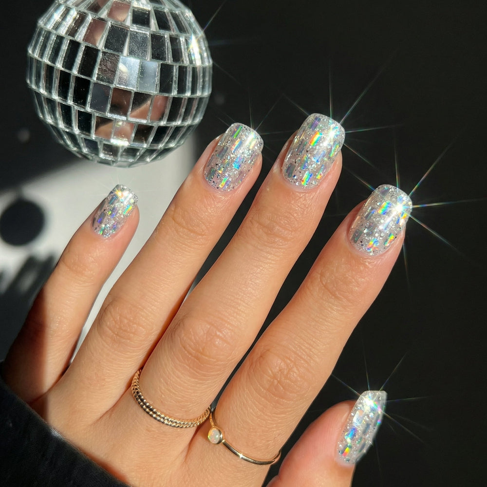 Model wearing Disco Spark Cubes almond press-on nails — lifestyle close-up | GlossyMuse