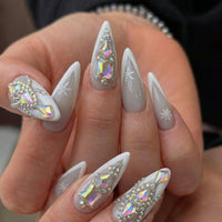 Frosted Glass Spikes press-on nails 3D detail shot — almond shape | GlossyMuse