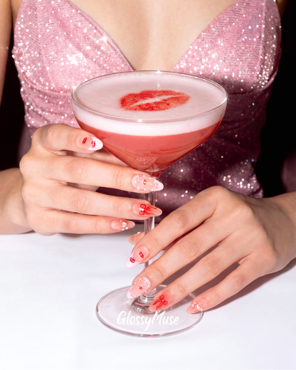 Model wearing Cherry Kiss Martini almond press-on nails — lifestyle close-up | GlossyMuse