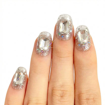 Model wearing Ice Glass Stones almond press-on nails — lifestyle close-up | GlossyMuse