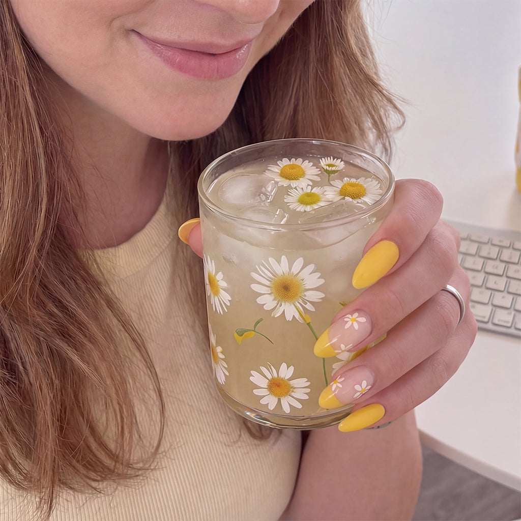 Model wearing Lemon Daisy Collins almond press-on nails — lifestyle close-up | GlossyMuse