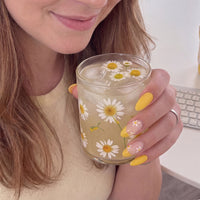 Model wearing Lemon Daisy Collins almond press-on nails — lifestyle close-up | GlossyMuse
