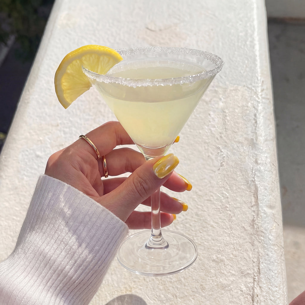 Lemon Drop Martini press-on nail kit contents — adhesive tabs, file and cuticle pusher | GlossyMuse