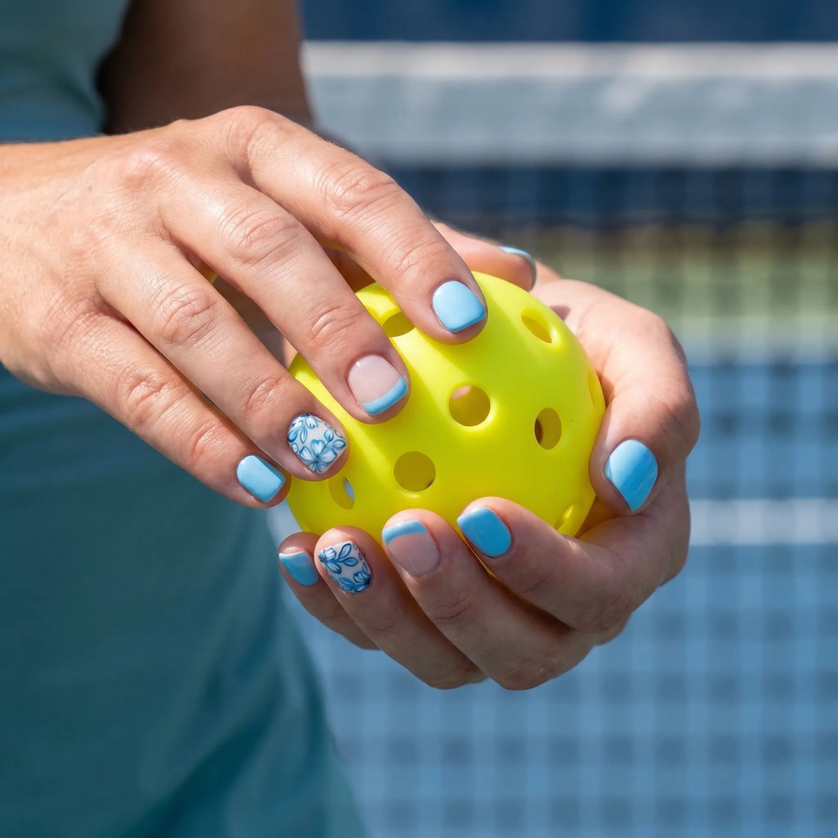 Morning Bloom pickleball nail detail — sky blue hand-painted floral overlay | GlossyMuse