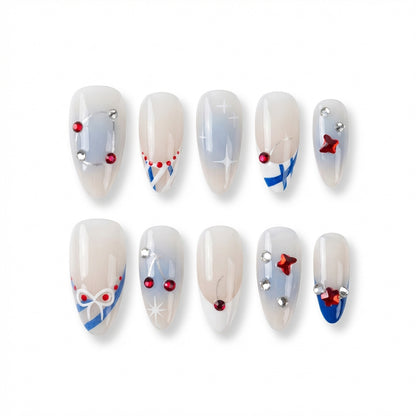 Ten decorative almond nails with festive designs, including bows, stars, and beads.