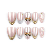 Ribbon Glow | Golden Bow Medium Almond Press On Nails