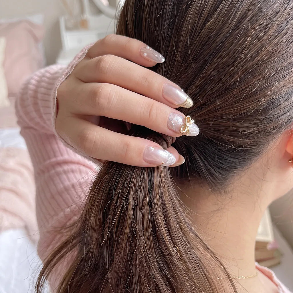 Ribbon Glow | Golden Bow Medium Almond Press On Nails