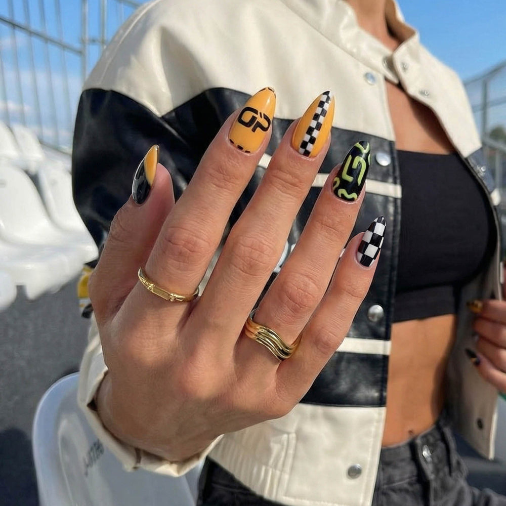 Colorful nail designs with yellow, black, white, and green patterns including checkers and numbers.