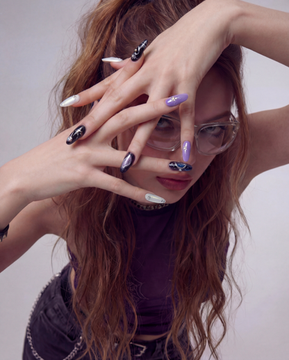 Shimmery White & Purple Star press-on nail kit contents — adhesive tabs, file and cuticle pusher | GlossyMuse
