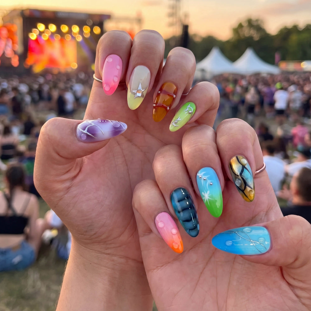 Ten colorful nail art samples featuring designs like stars, bubbles, and stripes.
