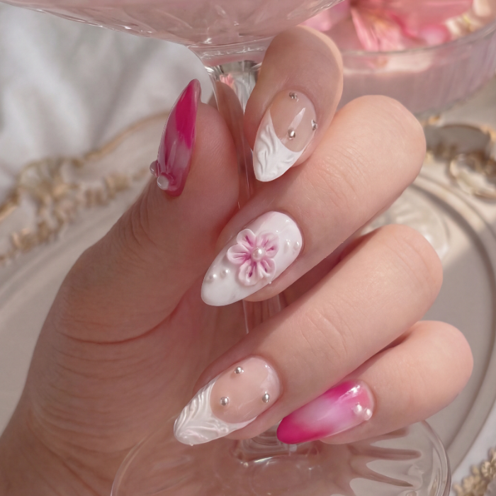 Model wearing Floral Pink Daiquiri almond press-on nails — lifestyle close-up | GlossyMuse