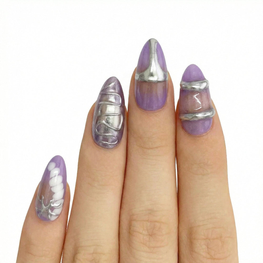 Model wearing Glam Purple & Silver Textured almond press-on nails — lifestyle close-up | GlossyMuse